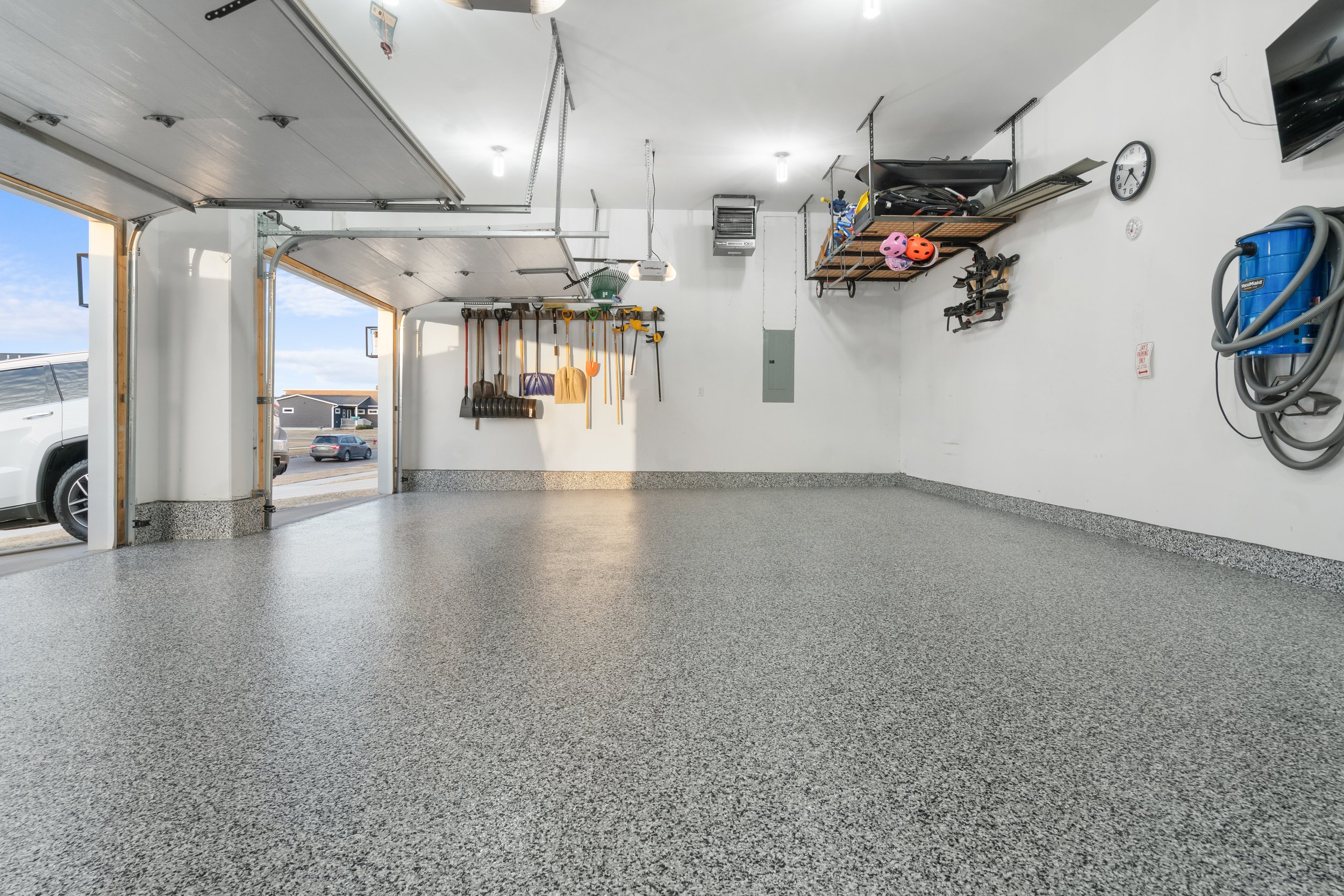 Finished flake-coated garage floor by Confluence Coatings